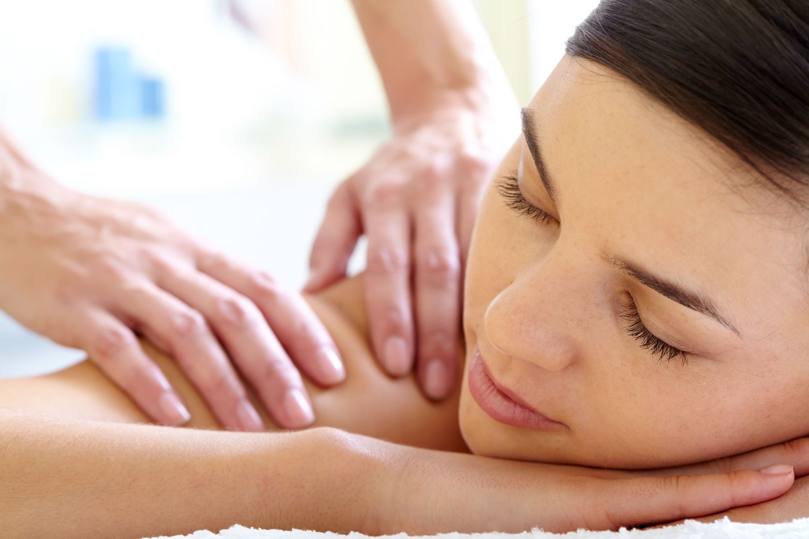 Relaxing massage therapy session showing peaceful client